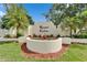 Community entrance sign for Royal Lakes surrounded by flowers and palm trees at 12119 Buffington Ln, Riverview, FL 33579