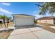 Charming home exterior with a white garage door and well-maintained driveway at 12119 Buffington Ln, Riverview, FL 33579