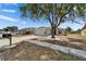 Inviting single-story home with a two-car garage, manicured landscaping and shade trees at 12119 Buffington Ln, Riverview, FL 33579