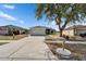 Charming single-story home with a well-manicured front yard and a two-car garage at 12119 Buffington Ln, Riverview, FL 33579