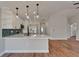 Bright kitchen featuring white cabinets, quartz counters, and stainless appliances at 12119 Buffington Ln, Riverview, FL 33579