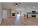 Spacious living room with a fireplace, kitchen, and an outdoor view at 12119 Buffington Ln, Riverview, FL 33579