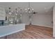 Open concept living area with kitchen island and a fireplace at 12119 Buffington Ln, Riverview, FL 33579