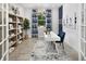 Stylish home office with built-in shelving, a modern desk, and ample natural light, perfect for remote work at 12313 49Th E St, Parrish, FL 34219