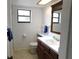Bathroom featuring a vanity with a solid surface top and tile flooring at 124 Woodlake Wynde, Oldsmar, FL 34677
