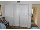 Bedroom closet with white folding doors providing ample storage space at 124 Woodlake Wynde, Oldsmar, FL 34677