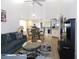 Spacious open living area with a dining table, wet bar, and views of the kitchen and the outdoor patio at 124 Woodlake Wynde, Oldsmar, FL 34677