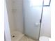 Shower with glass doors and tiled surround at 124 Woodlake Wynde, Oldsmar, FL 34677