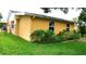 Well-maintained backyard with lush lawn and garden, perfect for outdoor activities at 12407 Partridge Hill Row, Hudson, FL 34667