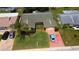 Beautifully landscaped home with a well-manicured lawn and a charming walkway leading to the front entrance at 12407 Partridge Hill Row, Hudson, FL 34667