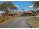 Attractive exterior of the community building showcasing well-maintained landscaping and a welcoming entrance at 12407 Partridge Hill Row, Hudson, FL 34667