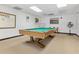 Spacious game room with a billiard table, offering entertainment for residents at 12407 Partridge Hill Row, Hudson, FL 34667
