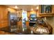 Spacious kitchen with stainless steel appliances, wood cabinets, and granite countertops perfect for cooking at 12407 Partridge Hill Row, Hudson, FL 34667