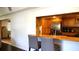 Kitchen with stainless appliances, wood cabinets, and hardwood floors at 12407 Partridge Hill Row, Hudson, FL 34667