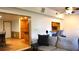 Open-concept living room with hardwood floors and kitchen bar access at 12407 Partridge Hill Row, Hudson, FL 34667