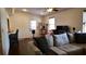 Inviting living room features hardwood floors, neutral paint, and a ceiling fan at 12407 Partridge Hill Row, Hudson, FL 34667
