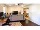 Bright living room featuring hardwood floors, natural light, and neutral paint at 12407 Partridge Hill Row, Hudson, FL 34667