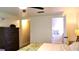 Bright main bedroom features a ceiling fan and ensuite bath access at 12407 Partridge Hill Row, Hudson, FL 34667
