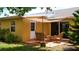 Secluded outdoor patio with seating area, accessed by door and sliding glass doors, perfect for relaxing in nature at 12407 Partridge Hill Row, Hudson, FL 34667
