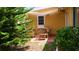 Cozy outdoor patio featuring comfortable wicker furniture, perfect for relaxing and entertaining in the garden at 12407 Partridge Hill Row, Hudson, FL 34667