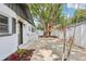 Charming home featuring a paved backyard patio area with a beautiful mature shade tree at 1332 Marjohn Ave, Clearwater, FL 33756
