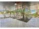 This screened-in patio offers an inviting transition to the outdoors and views of the landscaped backyard at 1332 Marjohn Ave, Clearwater, FL 33756