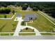 Aerial view of a home featuring a circular driveway and a large yard at 13338 Jaudon Ranch Rd, Dover, FL 33527