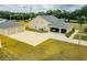 Aerial view of a home featuring an attached garage and a detached garage at 13338 Jaudon Ranch Rd, Dover, FL 33527