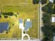 Overhead aerial view of a property featuring a well manicured lawn at 13338 Jaudon Ranch Rd, Dover, FL 33527