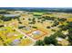Spacious property showcasing a lush landscape with mature trees, a charming neighborhood, and nearby ponds at 13338 Jaudon Ranch Rd, Dover, FL 33527