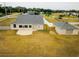 Backyard view featuring a large yard and an outbuilding at 13338 Jaudon Ranch Rd, Dover, FL 33527