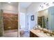 Neutral bathroom with a shower and tub combination, a vanity with granite countertops, and tile flooring at 13338 Jaudon Ranch Rd, Dover, FL 33527