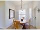 Cozy dining area with natural light and modern chandelier at 13338 Jaudon Ranch Rd, Dover, FL 33527