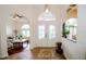 Inviting foyer with decorative glass doors, tile floors, and views into the living spaces at 13338 Jaudon Ranch Rd, Dover, FL 33527