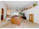 Spacious living room features tile flooring, neutral paint, and comfortable leather furniture at 13338 Jaudon Ranch Rd, Dover, FL 33527