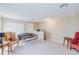 Upstairs living area with carpet, comfortable seating, and closet at 13338 Jaudon Ranch Rd, Dover, FL 33527