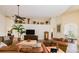 Comfortable living room with leather furniture, ceiling fan, and decorative shelving at 13338 Jaudon Ranch Rd, Dover, FL 33527