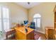 Bright office space with hardwood floors, plantation shutters, and a large wooden desk at 13338 Jaudon Ranch Rd, Dover, FL 33527