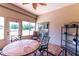 Enclosed patio with brick floors and outdoor seating at 13338 Jaudon Ranch Rd, Dover, FL 33527