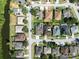 A high-angle aerial view shows the home's location within a community near a natural conservation area at 1447 Stetson Dr, Wesley Chapel, FL 33543