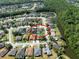 Aerial view of the home showcasing its ideal location near a pond and surrounded by beautiful mature trees at 1447 Stetson Dr, Wesley Chapel, FL 33543