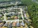 This aerial shows the home within a community with proximity to conservation areas and nearby ponds at 1447 Stetson Dr, Wesley Chapel, FL 33543