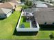 This aerial view showcases the home's fenced backyard, gazebo, and pool area in a well-maintained yard at 1447 Stetson Dr, Wesley Chapel, FL 33543
