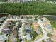 Aerial view of a charming neighborhood, surrounded by lush landscapes and picturesque waterways at 1447 Stetson Dr, Wesley Chapel, FL 33543