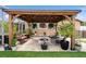 Beautiful backyard with a pergola, outdoor seating, and lush landscaping for relaxation and entertainment at 1447 Stetson Dr, Wesley Chapel, FL 33543