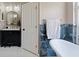 Elegant bathroom featuring a standalone tub, stylish vanity, and modern fixtures at 1447 Stetson Dr, Wesley Chapel, FL 33543