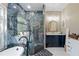 Elegant bathroom featuring a standalone tub, stylish vanity, and a walk-in shower with decorative tile at 1447 Stetson Dr, Wesley Chapel, FL 33543