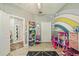 Bright bedroom with whimsical decor, ample storage, and playful accents at 1447 Stetson Dr, Wesley Chapel, FL 33543