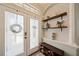 Charming foyer featuring patterned tile flooring, stylish decor, and a chandelier at 1447 Stetson Dr, Wesley Chapel, FL 33543