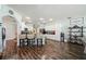 Bright, open kitchen with white cabinetry, stainless steel appliances, and breakfast bar seating at 1447 Stetson Dr, Wesley Chapel, FL 33543